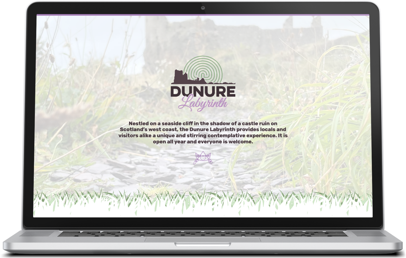 Dunure Labyrinth website displayed on a laptop screen.